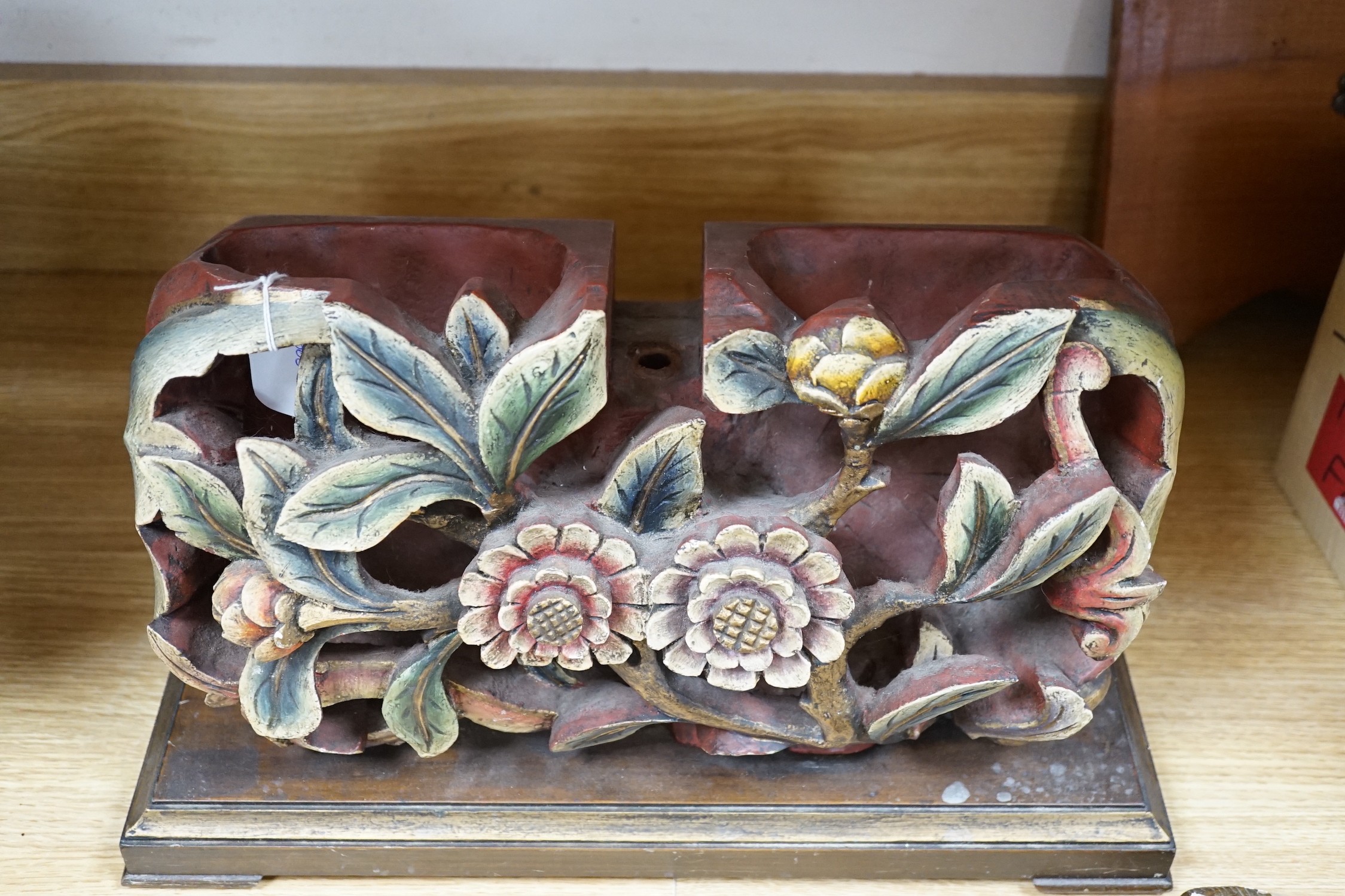 A Chinese floral wooden carving, 40cm wide
